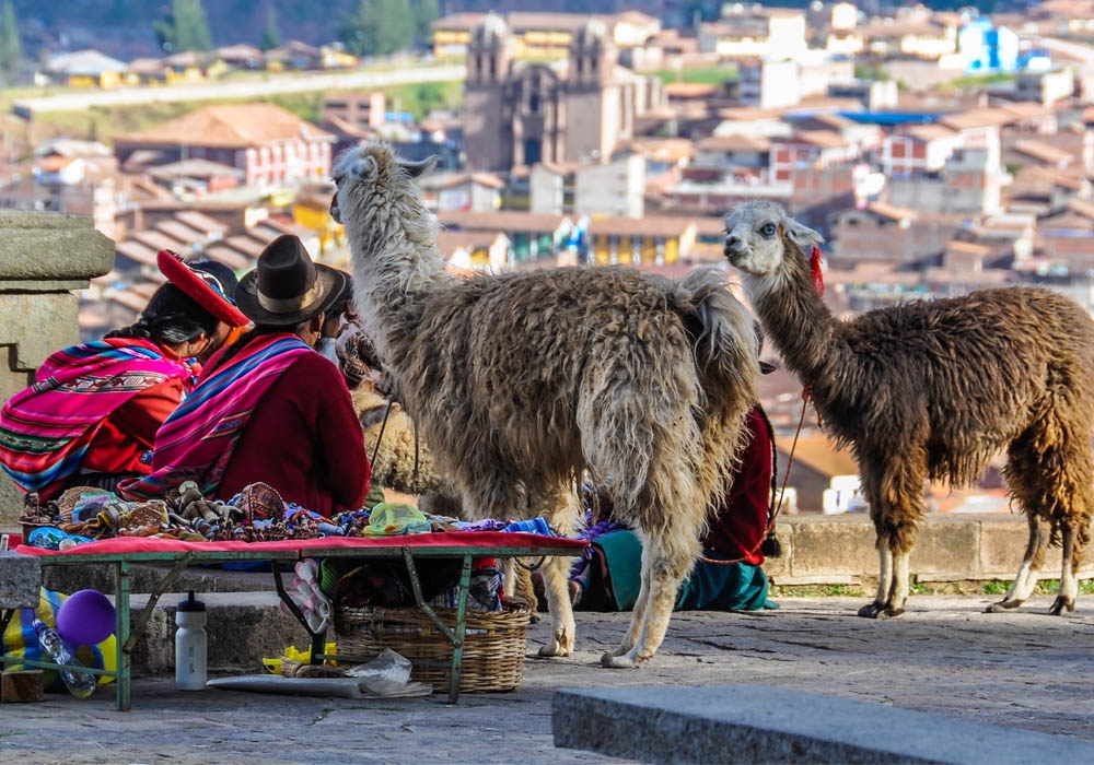 Cusco street vendors selling souvenirs and images of llamas