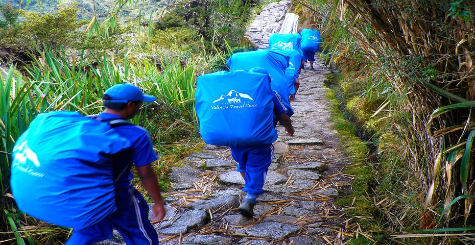 When booking your Inca Trail Trek to Machu Picchu, make sure you book with a responsible Machu Picchu tour company like Valencia Travel. Ensure that they provide fair wages, proper equipment, and adequate support for porters who carry all the supplies during the trek.