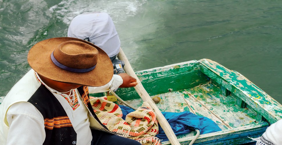 Experience authentic Peruvian culture on your lake titicaca tours from Puno. As you leave Puno to Lake Titicaca, witness scenes like this traditional fisherman along the shores of Titicaca.