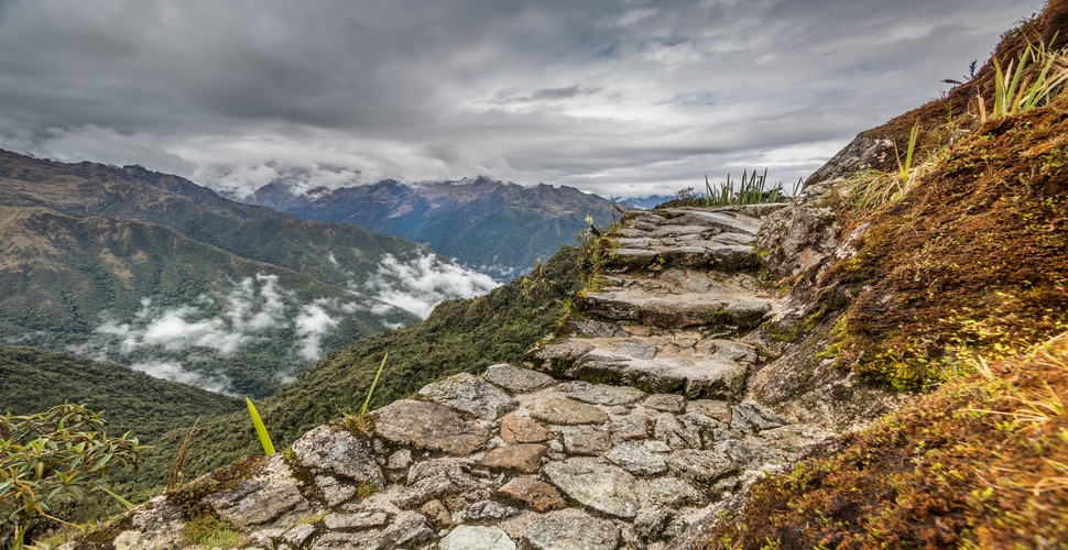 Trekking the original Inca Trail to Machu Picchu is a once-in-a-lifetime experience. It offers a unique blend of adventure, history, and awe-inspiring scenery. Follow in the footsteps of the ancient Incas, as you hike a route through stunning mountain landscapes.