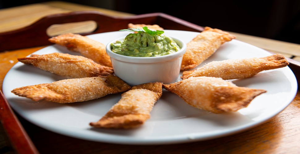 Make sure you sample the crispy and savory delight of tequeños, on your Peru culture trip. These cheese-filled treats are wrapped in dough, fried to golden perfection, and served with your favorite dipping sauce. 