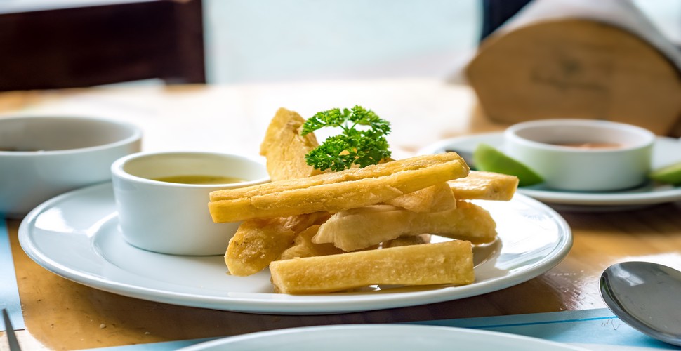 When you travel to Cusco, Peru, yuca fritas, or fried yuca, are a popular dish served in many restaurants and bars. Yuca, also known as cassava, is peeled, cut into pieces, and fried until golden and crispy on the outside and soft on the inside. They are served hot as a side dish or appetizer.
