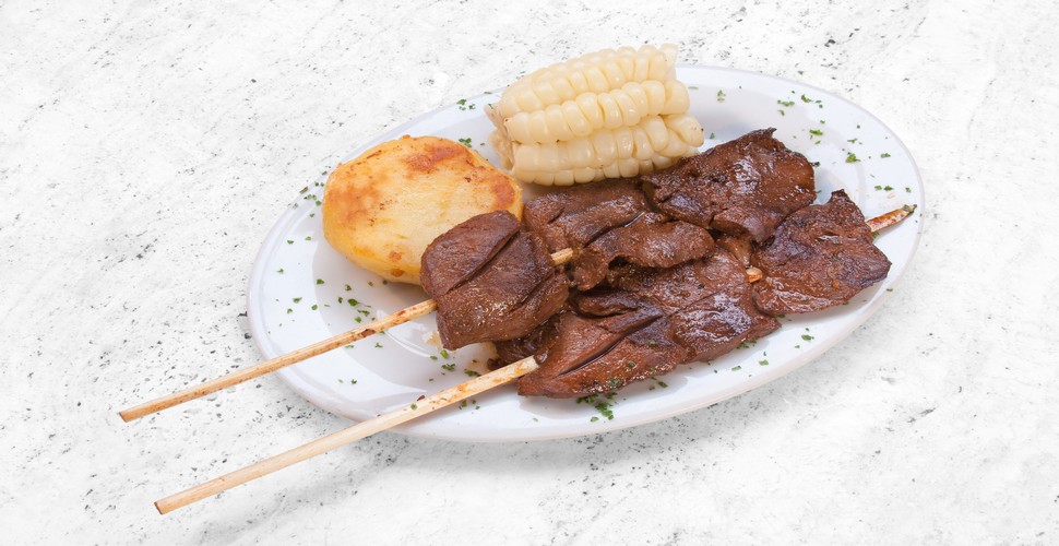 Anticuchos are a popular Peruvian street food and appetizer that consist of marinated and grilled skewers of beef heart. Other meats such as chicken, pork, and fish can also be used. Anticuchos are found on every Street corner when you travel to Cusco Peru. 