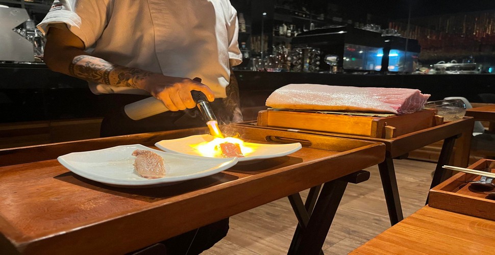 Cooking at your table, also known as "teppanyaki," is a style of Japanese cuisine available when you visit Lima. This is where a chef prepares food on a flat iron griddle in front of diners. 