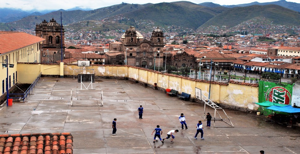 Concrete pitches at schools are common in many parts of the world, including Peru. These pitches provide a hard, durable surface for playing football in regions such as Cusco. You may come across one when you travel to Cusco Peru.
